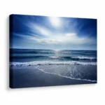 Large ocean canvas wall art displayed in a modern living room with luxury coastal interior styling