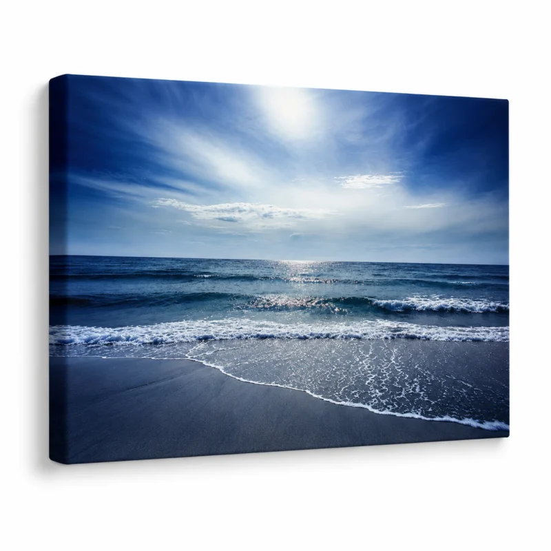 Large ocean canvas wall art displayed in a modern living room with luxury coastal interior styling