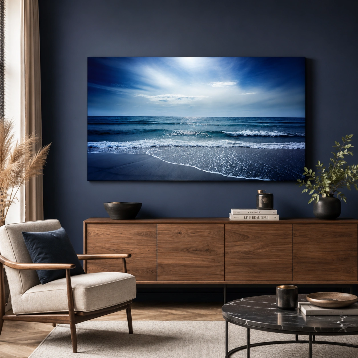 Large ocean canvas wall art displayed in a modern living room with luxury coastal interior styling